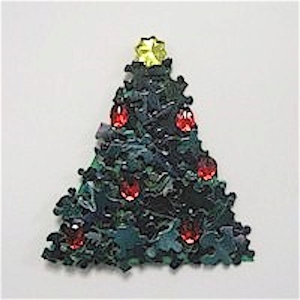 Recycle puzzle pieces into a fun Christmas Tree.