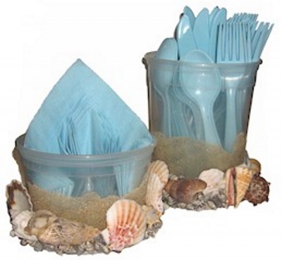 Use seashells to make napkin and utensil holders