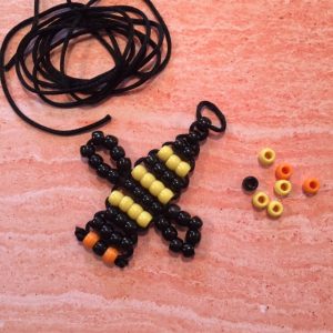 Bee made from black and yellow pony beads.