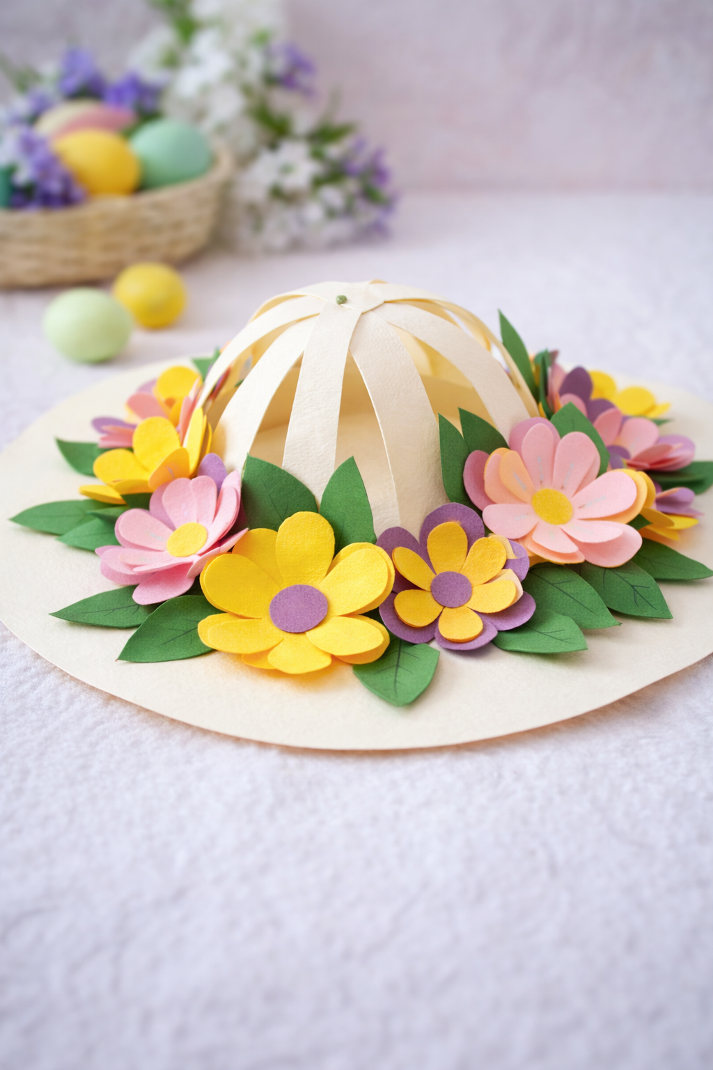 finished paper bonnet for easter, decorated with paper cut out flowers