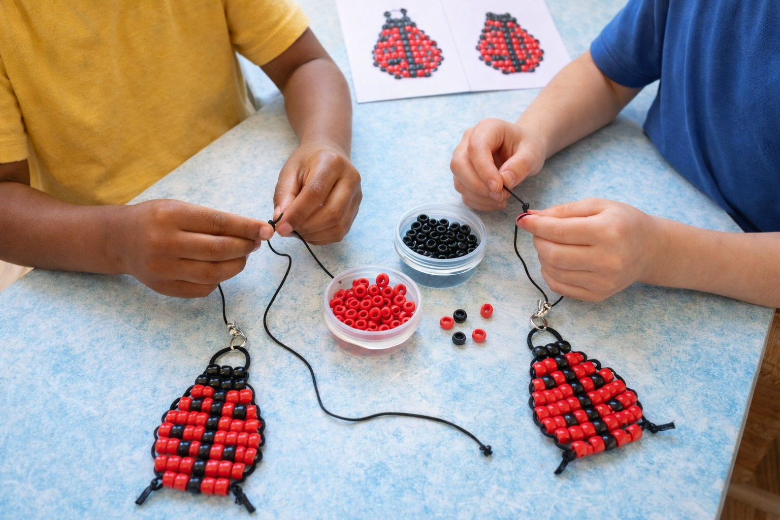 kids making ladybug beaded keychain