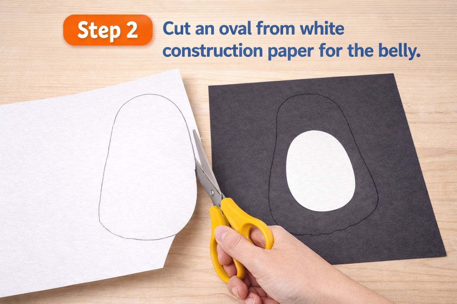placing oval piece of construction paper on black cutout paper to create body of penguin craft