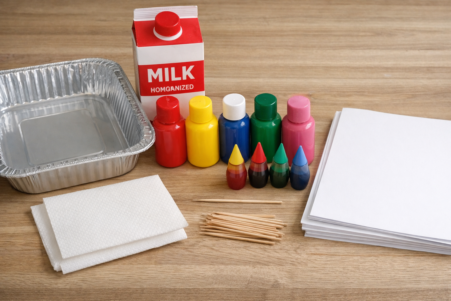 magic heart painting craft supplies including milk, a pan, and paints